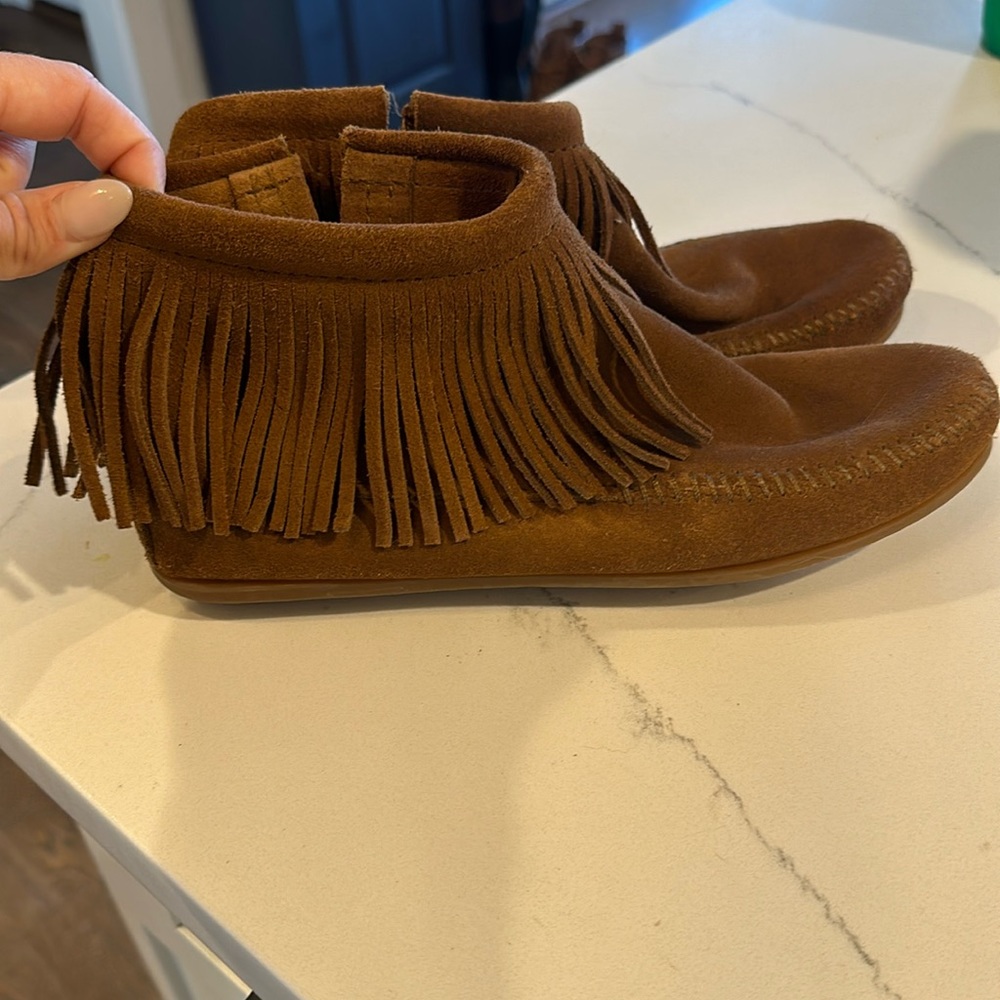 Minnetonka moccasins. Zip side closure. Worn once for a photo shoot.